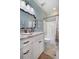 Bathroom features vanity with large mirror, tile flooring, and a shower-tub combination at 4228 Ravenwood Dr., Little River, SC 29566