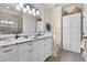 Spacious bathroom featuring double vanity with marble countertop and decorative accents at 4228 Ravenwood Dr., Little River, SC 29566
