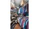 Walk-in closet with built-in shelving and ample storage space for shoes and clothing at 4228 Ravenwood Dr., Little River, SC 29566