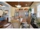 Inviting dining room with a wood ceiling, adjacent to a living area, ideal for entertaining at 4228 Ravenwood Dr., Little River, SC 29566