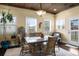 Bright dining area featuring a wood ceiling, a chandelier, and multiple windows at 4228 Ravenwood Dr., Little River, SC 29566
