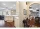 Hallway with a view of the kitchen and living room, highlighting the open floor plan at 4228 Ravenwood Dr., Little River, SC 29566