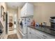 Well-organized laundry room with washer, dryer, and ample counter space at 4228 Ravenwood Dr., Little River, SC 29566