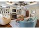 Inviting living room with coffered ceiling, stone fireplace, built-ins, and hardwood floors at 4228 Ravenwood Dr., Little River, SC 29566