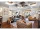 Bright living room with a cozy seating area, fireplace, and open floor plan at 4228 Ravenwood Dr., Little River, SC 29566