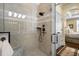 Glass shower featuring tile surround, rain shower head, and modern fixtures at 4228 Ravenwood Dr., Little River, SC 29566