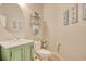 Charming bathroom features a green vanity and toilet with marble sink and beach-themed decor at 432 Highfield Loop, Myrtle Beach, SC 29579