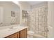 Well-lit bathroom with a vanity, shower curtain, and decorative accents at 432 Highfield Loop, Myrtle Beach, SC 29579