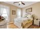 Comfortable bedroom with a bed, white curtains, and wood-look flooring at 432 Highfield Loop, Myrtle Beach, SC 29579