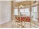 Bright breakfast nook with large windows, a table with four chairs and access to storage at 432 Highfield Loop, Myrtle Beach, SC 29579