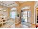 Inviting foyer with hardwood floors, arched doorways, and natural light. Features a view into dining area at 432 Highfield Loop, Myrtle Beach, SC 29579