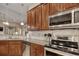 Modern kitchen featuring stainless steel appliances, granite counters, and tile backsplash at 432 Highfield Loop, Myrtle Beach, SC 29579