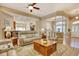Open-concept living room featuring hardwood floors, seating, and access to other areas of the home at 432 Highfield Loop, Myrtle Beach, SC 29579