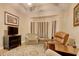 Cozy sitting area with a bay window, comfortable chairs, and a patterned rug at 432 Highfield Loop, Myrtle Beach, SC 29579