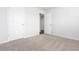 Carpeted bedroom features neutral walls, white doors, and plenty of natural light at 44 Cape Point Dr., Conway, SC 29527