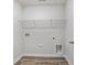 Neutral laundry room with a utility sink hookup, a washing machine hookup, and a wire rack for storage at 4476 East Coast Ln., Shallotte, NC 28470