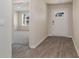 Inviting foyer with wood-look flooring leading to a bright living space and the front door at 4480 East Coast Ln., Shallotte, NC 28470