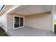 Covered patio with sliding glass door, offering a seamless transition to indoor living at 4480 East Coast Ln., Shallotte, NC 28470