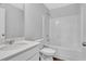 Bathroom featuring a tub, toilet, and sink with bright white fixtures at 48 Cape Point Dr., Conway, SC 29527