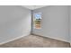 Carpeted bedroom with a single window and painted in neutral gray tone at 48 Cape Point Dr., Conway, SC 29527