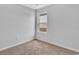 Neutral bedroom with tan carpet, a window with natural light, and gray walls at 48 Cape Point Dr., Conway, SC 29527