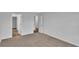Bedroom view, revealing carpet, light gray walls, and an entrance to another room at 48 Cape Point Dr., Conway, SC 29527
