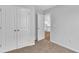 Bedroom with gray walls, tan carpet, and a closet with double doors at 48 Cape Point Dr., Conway, SC 29527