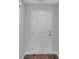 A clean white door with a simple design and wood flooring in a neutral-toned room at 48 Cape Point Dr., Conway, SC 29527
