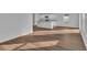 Bright kitchen features an island with white cabinets, granite countertops, and wood-look flooring at 48 Cape Point Dr., Conway, SC 29527