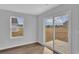 A bright space featuring sliding glass doors and a large window with a view of the backyard at 48 Cape Point Dr., Conway, SC 29527