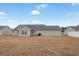 View of backyard with a small patio, grill and white vinyl fence at 480 Oakham Dr., Conway, SC 29527