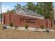 Attractive brick community sign featuring black lettering amidst landscaping, creating a welcoming entrance at 480 Oakham Dr., Conway, SC 29527