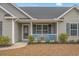Close-up of a home's charming front porch with decorative touches and ample curb appeal at 480 Oakham Dr., Conway, SC 29527