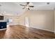 Bright, airy living room with hardwood floors, ceiling fan, and open access to the kitchen at 480 Oakham Dr., Conway, SC 29527