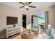 A staged living room with comfortable seating and a sliding glass door to the outside at 480 Oakham Dr., Conway, SC 29527