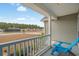 Cozy covered porch with comfortable blue seating and serene neighborhood view at 480 Oakham Dr., Conway, SC 29527