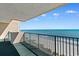 Relax on this condo balcony with beautiful ocean views and sea breezes, perfect for enjoying the coastal lifestyle at 501 S Ocean Blvd. # 1006, North Myrtle Beach, SC 29582