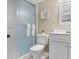 Clean bathroom featuring glass shower door, white tiled shower, toilet and modern vanity at 501 S Ocean Blvd. # 1006, North Myrtle Beach, SC 29582