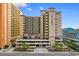 Exterior of The Verandas featuring convenient parking and a beautifully landscaped entrance, inviting you to call it home at 501 S Ocean Blvd. # 1006, North Myrtle Beach, SC 29582