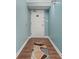 Entryway and hall to the home is decorated with soft blue walls and wood floors at 501 S Ocean Blvd. # 1006, North Myrtle Beach, SC 29582