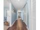 Hallway with wood floors and white closet doors and access to bedrooms at 501 S Ocean Blvd. # 1006, North Myrtle Beach, SC 29582