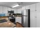 Kitchen featuring stainless steel appliances and white cabinets at 501 S Ocean Blvd. # 1006, North Myrtle Beach, SC 29582