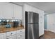 Kitchen showcasing stainless steel refrigerator and granite countertops at 501 S Ocean Blvd. # 1006, North Myrtle Beach, SC 29582