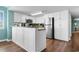 Well-lit kitchen featuring white cabinetry, stainless steel appliances, and granite countertops at 501 S Ocean Blvd. # 1006, North Myrtle Beach, SC 29582