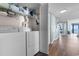 Convenient condo laundry room area with washer, dryer, and storage shelves, for easy living and functionality at 501 S Ocean Blvd. # 1006, North Myrtle Beach, SC 29582