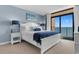 Comfortable bedroom with ocean views and modern decor at 501 S Ocean Blvd. # 1006, North Myrtle Beach, SC 29582