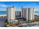 Stunning aerial view of an oceanfront resort featuring multiple towers and beautiful beachfront access at 5200 N Ocean Blvd. # 957, Myrtle Beach, SC 29577