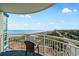 Balcony with ocean views, featuring a cozy chair, and panoramic vistas of the coastline at 5200 N Ocean Blvd. # 957, Myrtle Beach, SC 29577