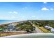 Scenic balcony view overlooking the ocean, sandy beaches, and charming beachfront homes along the coast at 5200 N Ocean Blvd. # 957, Myrtle Beach, SC 29577