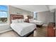 Bright bedroom with two beds, wood floors, light gray walls and water views at 5200 N Ocean Blvd. # 957, Myrtle Beach, SC 29577